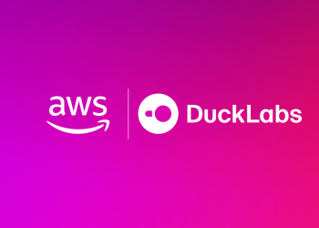 Official Amazon announcement graphic for the acquisition, showing the AWS logo and the DuckLabs logo side by side in white on a magenta and pink gradient background.