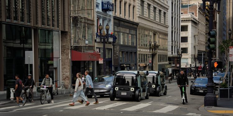 Zoox purpose-built robotaxi, a bidirectional four-passenger pod with no steering wheel and no pedals, photographed for the company announcement of its NHTSA Part 555 commercial exemption.