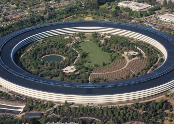 Aerial view of Apple Park, the circular Apple headquarters building in Cupertino, California, with its solar panel roof and central gardens