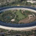 Aerial view of Apple Park, the circular Apple headquarters building in Cupertino, California, with its solar panel roof and central gardens
