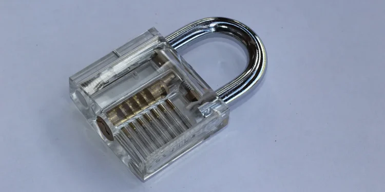 Transparent padlock for lockpicking training showing the internal pins and springs through its clear body