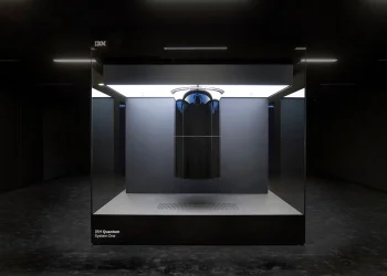 IBM Quantum System One quantum computer inside a glass enclosure in a dark room