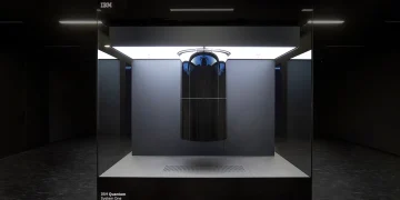 IBM Quantum System One quantum computer inside a glass enclosure in a dark room