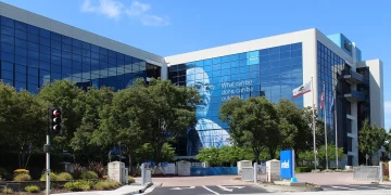 Intel headquarters in Santa Clara, California, a glass office building with the Intel sign at the entrance