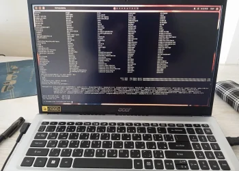 Acer laptop showing a full-screen Linux terminal where an Arch Linux system upgrade with sudo pacman -Syu is waiting for confirmation