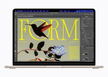 Front view of a MacBook Air with M5 in starlight finish showing a Photoshop document on its display