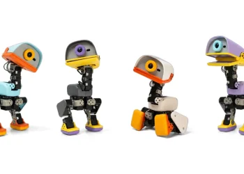 Four Microduck bipedal robots in different color schemes, each with a duck-bill style head and a camera eye, standing in various poses on a white background