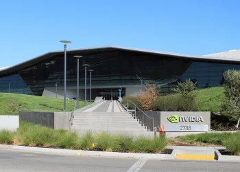 Entrance steps and glass facade of an Nvidia headquarters building in Santa Clara, California, next to an Nvidia sign