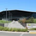 Entrance steps and glass facade of an Nvidia headquarters building in Santa Clara, California, next to an Nvidia sign