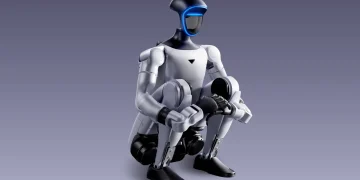 Unitree humanoid robot in a crouching pose with a glowing blue visor, official product render on a purple gradient background